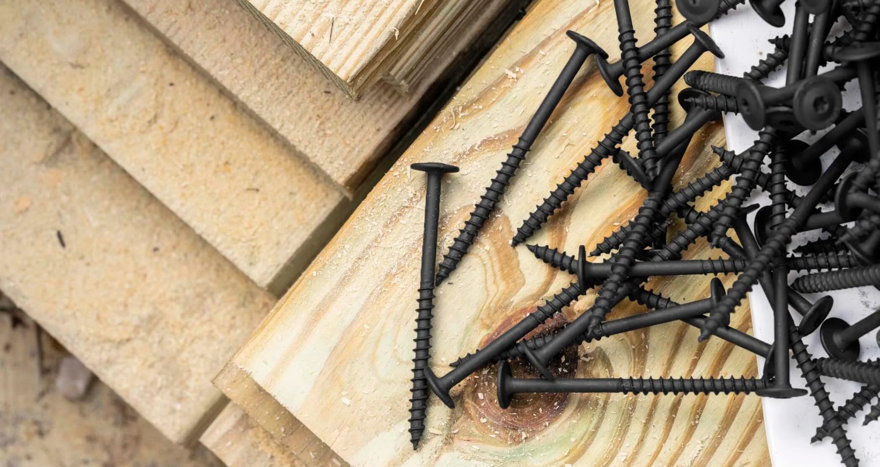 Black SPAX construction screws on lumber