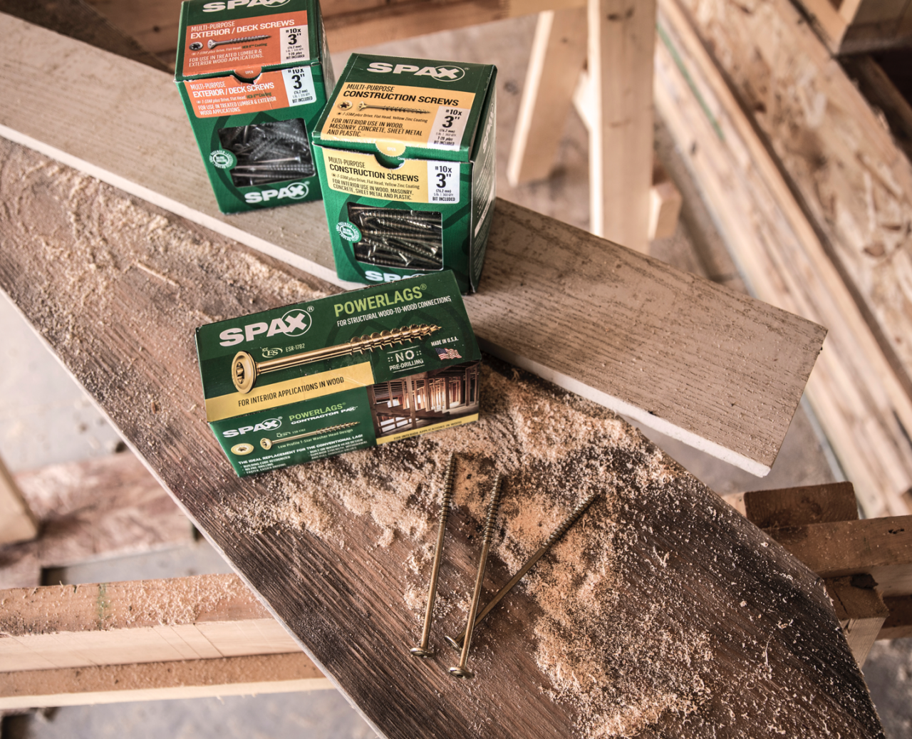 SPAX construction, deck, and PowerLags screw boxes on a lumber jobsite